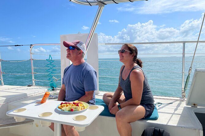 Key West: Sunset Sail + Reef Snorkel & Sandbar - Sunset Sail Back: Fruit, Photos, and BYOB Relaxation