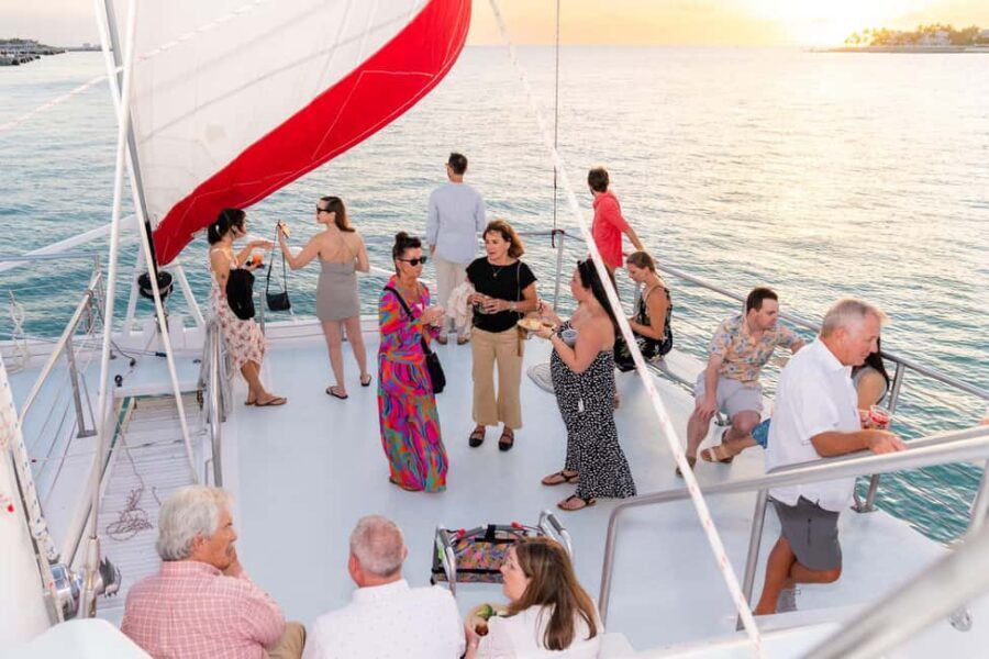 Key West: Sunset Sailing Trip with Open Bar, Food and Music - Helping raise sails and taking a turn at the wheel